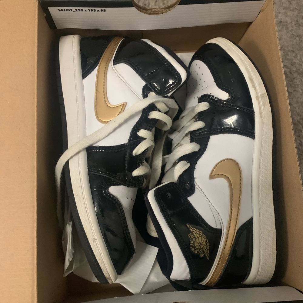 Size 2 boys black/white and gold Air Jordan’s with box